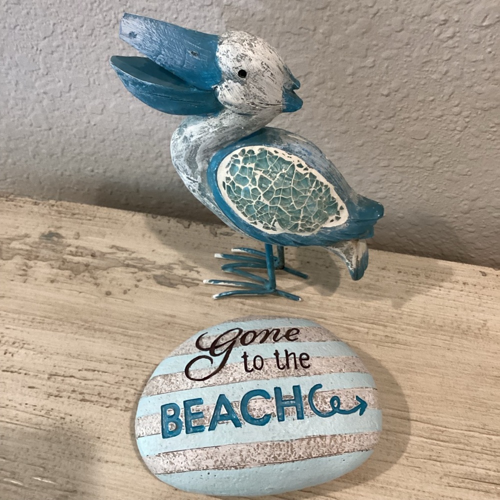 Blue and White Pelican Figurine with Beach Stone